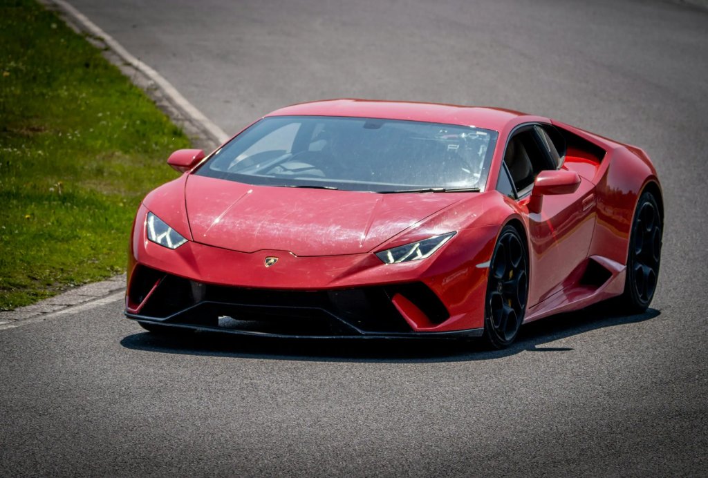 Sports car cornering at a UK circuit during a track day